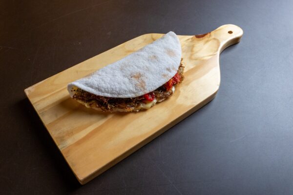 taco on wooden cutting board